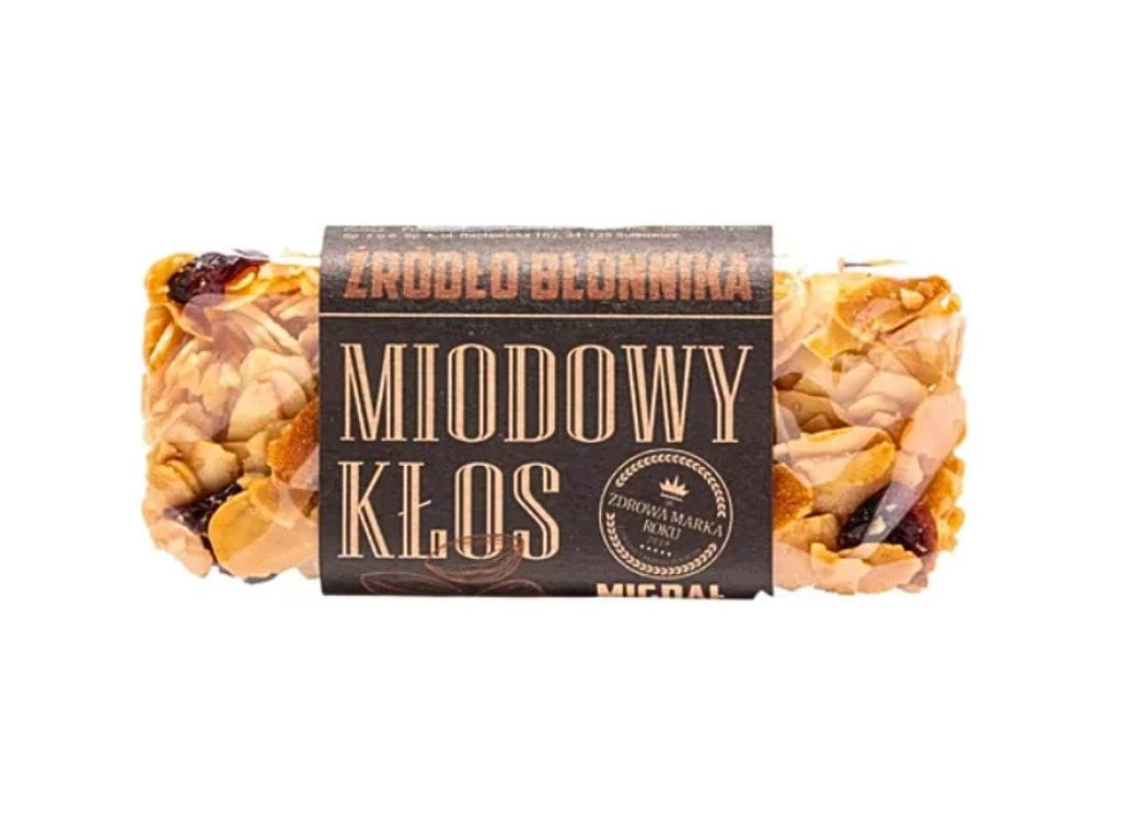 Naturalny baton miodowy Kłos z migdałem. Zdrowa, chrupiąca przekąska z miodem, pełnoziarnistymi zbożami i migdałami. Źródło błonnika i naturalnej energii dla aktywnych i dbających o zdrową dietę.